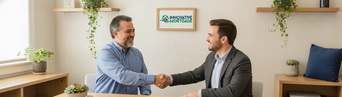 Two professionals shaking hands in a modern lending office